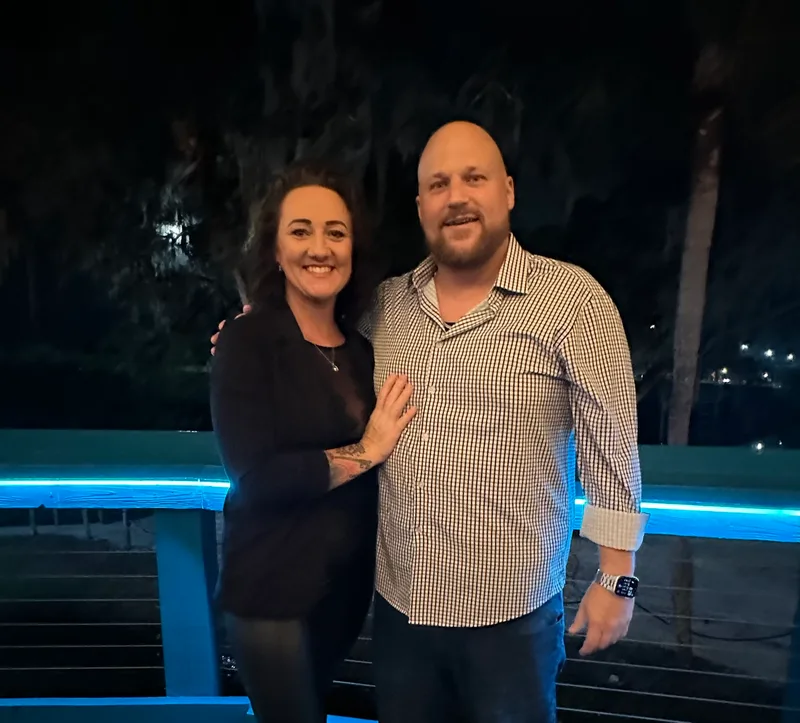 Jacob and Nicole on a boardwalk at night